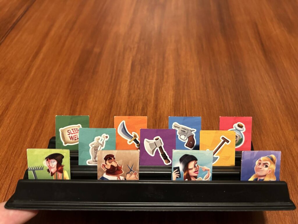The various weapon and murderer tokens on one of the included displays.